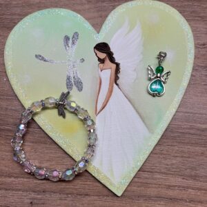 Andělská sada plná světla se symbolem vážky jako rovnováhy | Zelenkavá